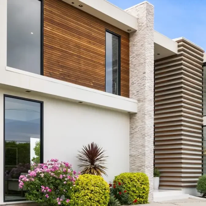 A Driveway of a contemporary house with a garden area
