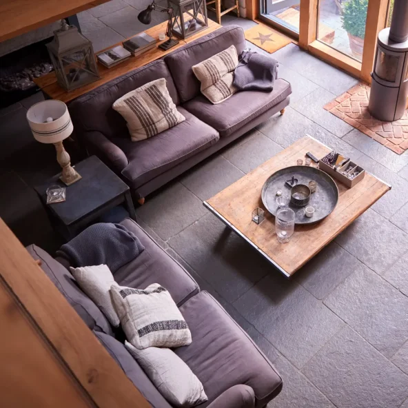 Overhead Shot Of Lounge In Modern Open Plan House Or Apartment With Sofas And Table